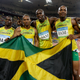 L-R: Nesta Carter, Michael Frater, Usain Bolt, and Asafa Powell. Photo by David J. Phillip/AP Images